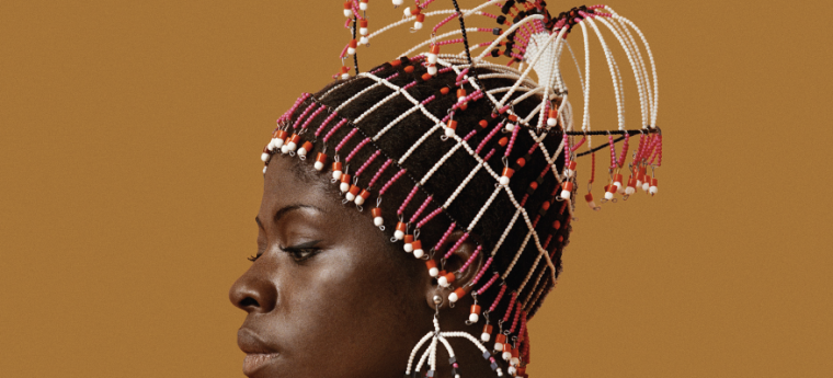 Sikolo Brathwaite wearing a headpiece designed by Carolee Prince